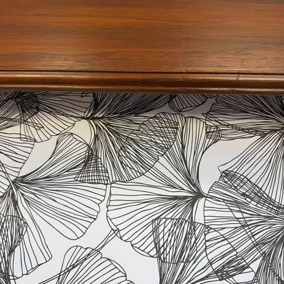 Botanical paper detail inside a furniture drawer